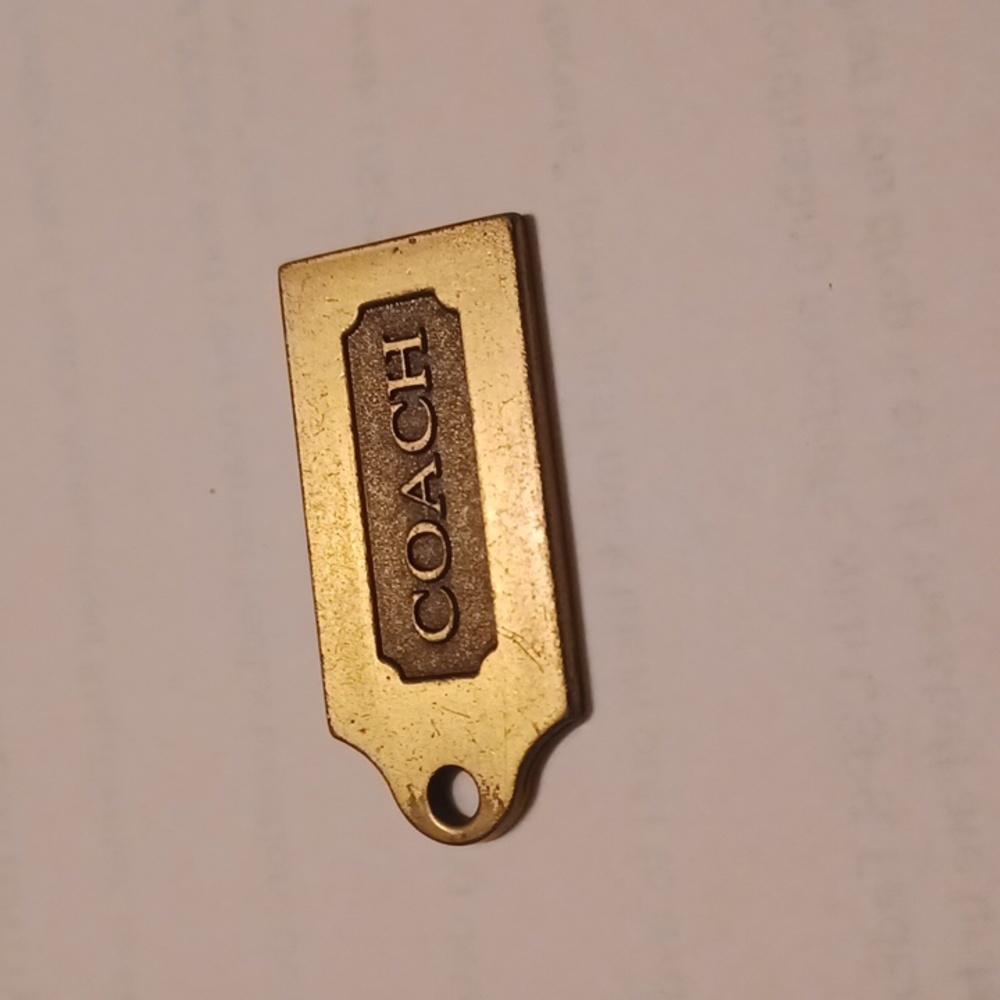 Coach key chain metal gold color